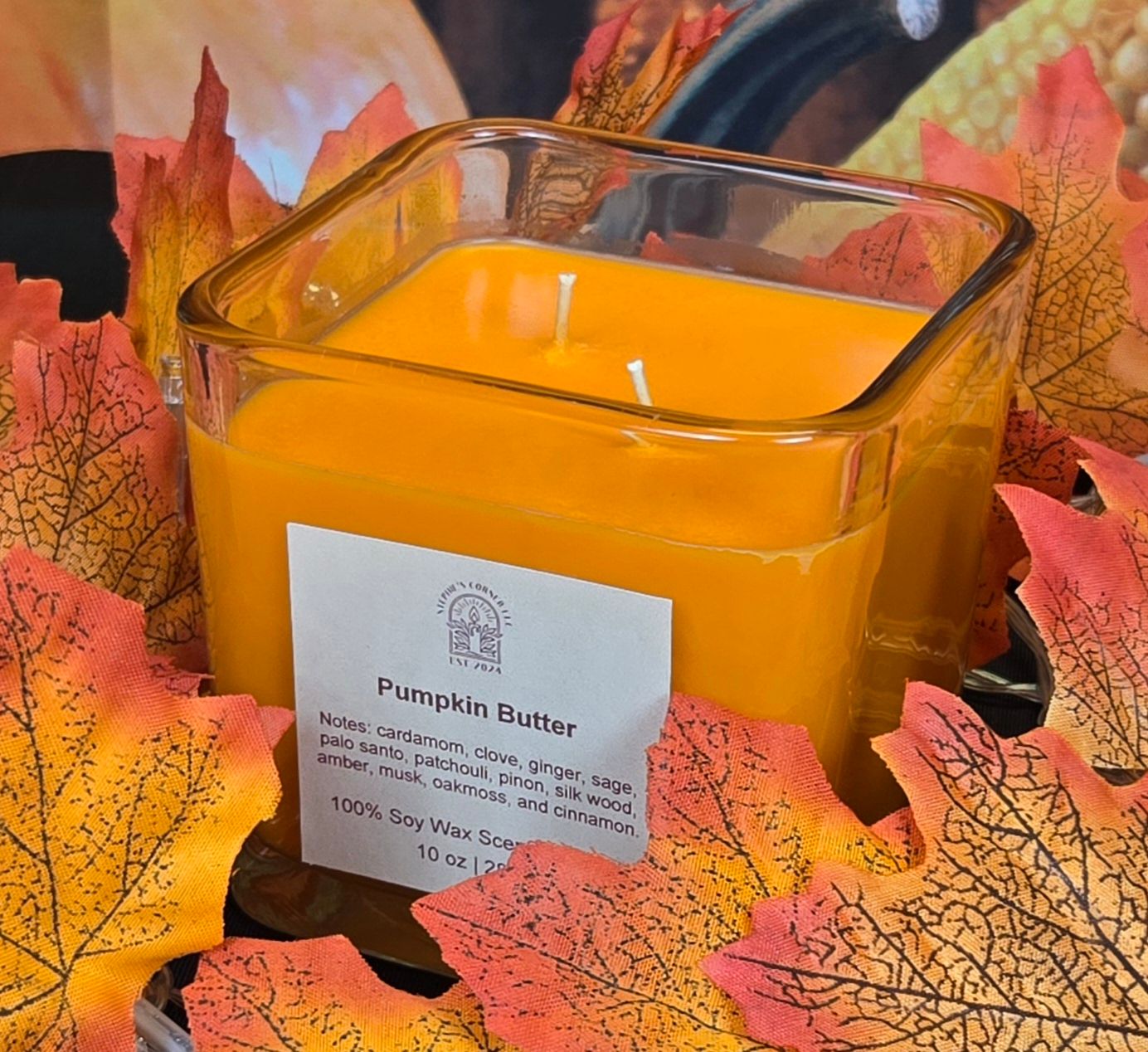 Pumpkin Butter scented 100% soy candle in a 10 ounce glass cube jar.
