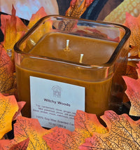 Witchy Woods scented 100% soy candle in a 10 ounce glass cube jar.