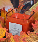 Spicy Pumpkin scented 100% soy candle in a 10 ounce glass cube jar.