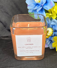 Leather scented 100% soy candle in a 5 ounce glass cube jar.
